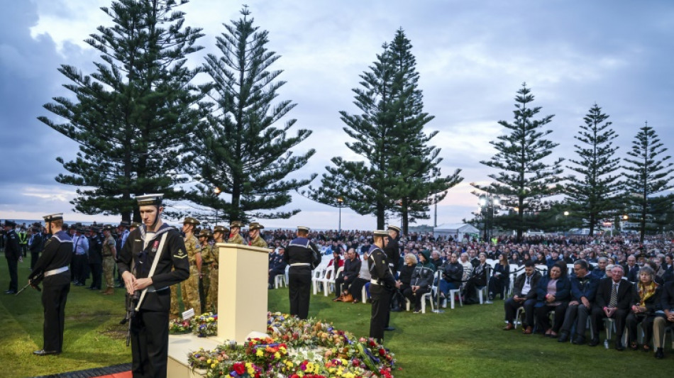 Crowds join Anzac Day services for Australia, New Zealand forces