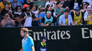 Exhausted Wawrinka battles on in Melbourne farewell after five-set epic