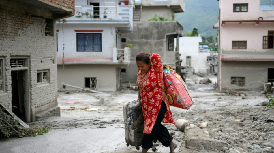 Rescuers claw through mud as Nepal, China flood missing toll nears 3,000