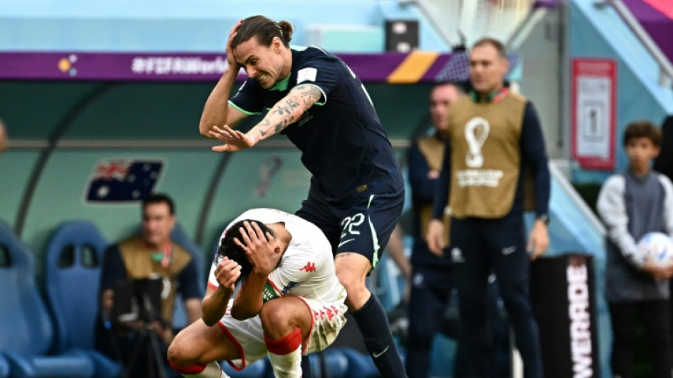 Gutsy Australia squeeze past Tunisia to revive World Cup hopes
