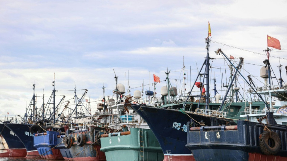 Thousands of Chinese boats mass at sea, raising questions