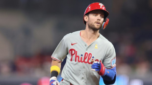 Phillies shortstop Turner, NL batting leader, strains hamstring