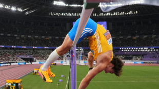 Duplantis sets new pole vault record as retains world title