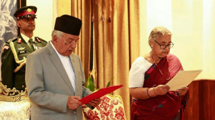 Nepal returns to calm as first woman PM takes charge